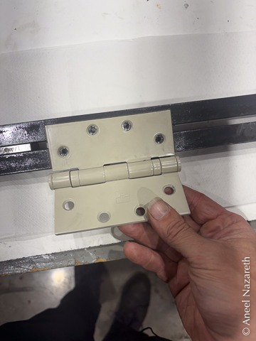 The recess fits the hinge and the screw holes line up
